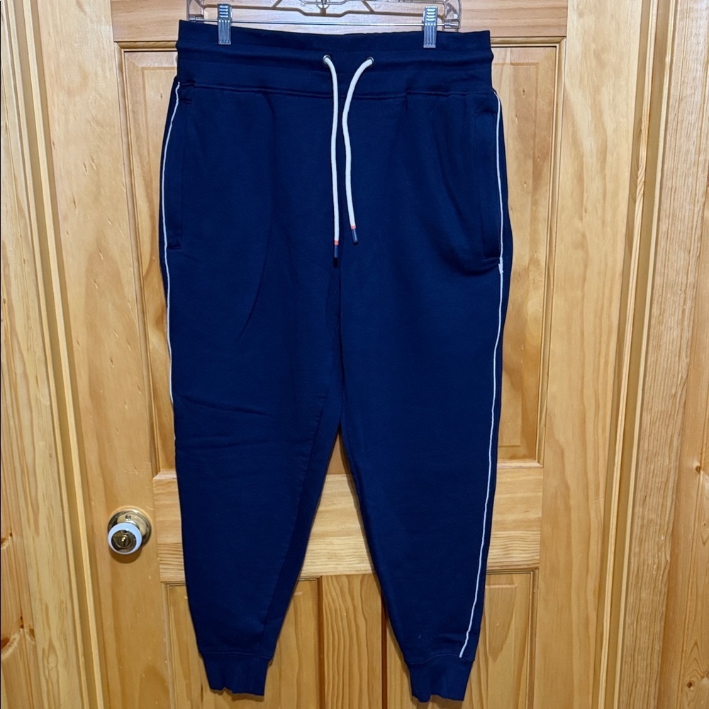 Cotopaxi Dark Blue Joggers with White Accents, Zip Pockets, Size Large.